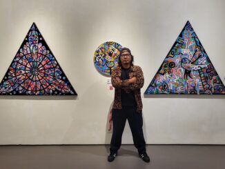 Made Bayak in front of his latest work, the Basel Series, on display at Zen-1 Gallery Jakarta. (Photo by Zen-1 Gallery Jakarta).